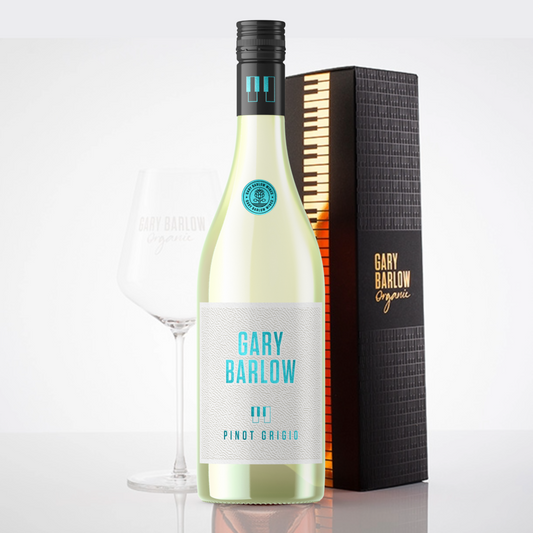 Gary Barlow Piano Box Pinot Grigio Gift Set featuring a high-quality, embossed piano box, a bottle of Gary Barlow Pinot Grigio, and an elegant wine glass.