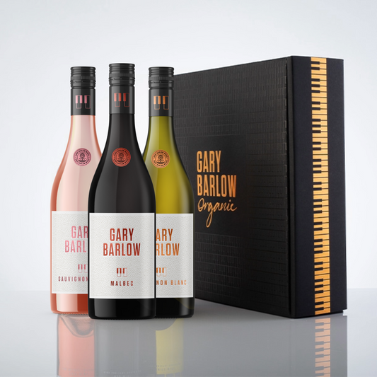 Gary Barlow Trio Wow Box featuring three bottles of wine: Sauvignon Blush, Malbec, and Sauvignon Blanc, beautifully presented in a black matte piano key design box with copper embossing.